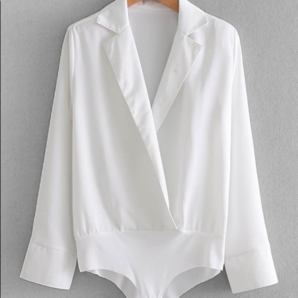 Brand NWT. White spliced neck Body Suit